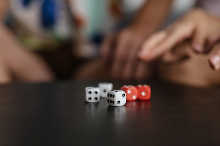A set of white and red D6 dice on a table