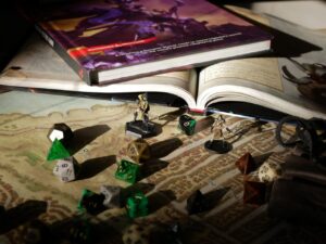 Gaming dice and D&D Books on a tabletop.