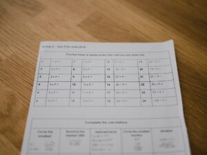 A downloadable PDF worksheet being filled out by a student
